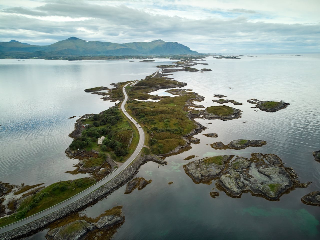 Breathtaking aerial view of the Atlantic Ocean Road in Norway, showcasing the stunning coastal landscape and winding bridges.